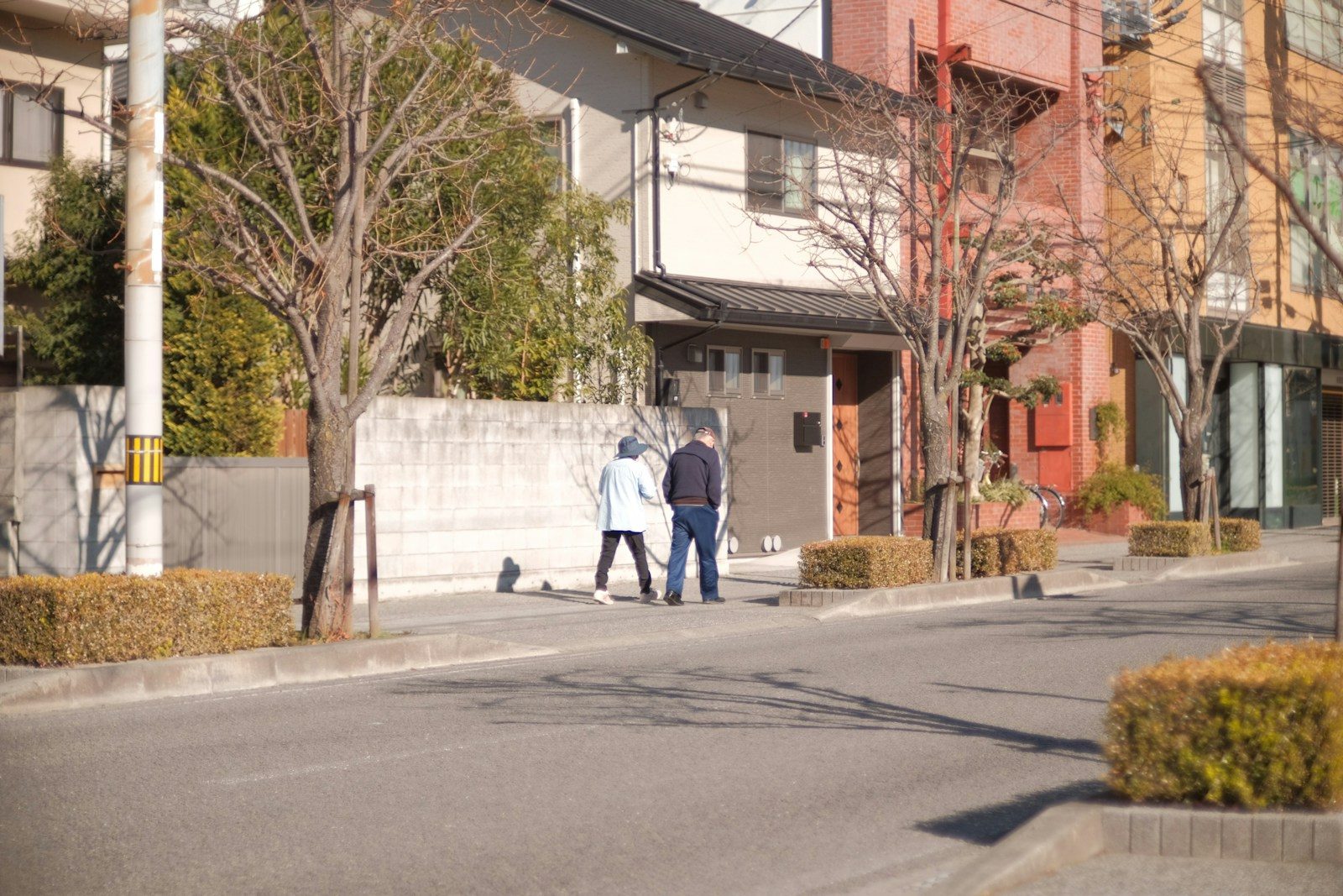 a man and a woman walking down a street